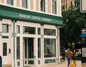 A couple walks past Madcap Coffee Company in downtown Grand Rapids, Michigan. in Grand Rapids Scavenger Hunt, MI
