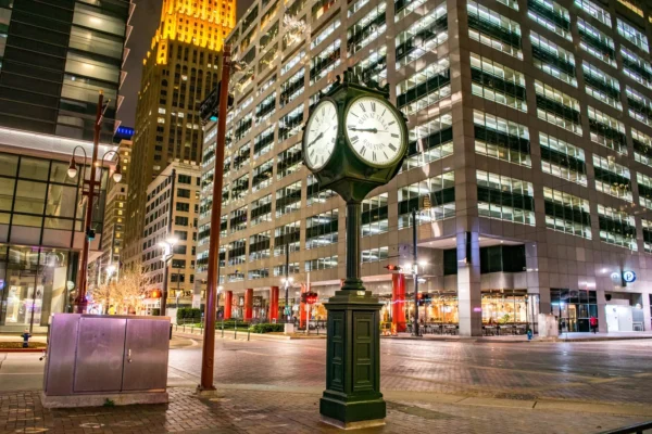 Illuminated clock and modern skyscrapers in downtown Houston at night. in Houston Scavenger Hunt, TX
