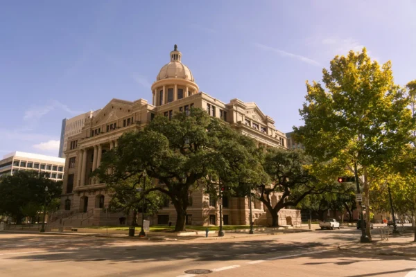 Stunning view of a historic courthouse building with trees, in downtown Houston, Texas. in Houston Scavenger Hunt, TX