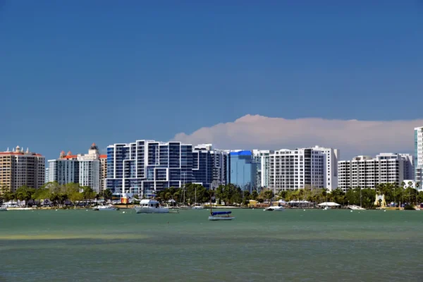 Panoramic view of Sarasota, Florida skyline against a blue sky, featuring modern architecture and waterfront. in Sarasota Scavenger Hunt, FL