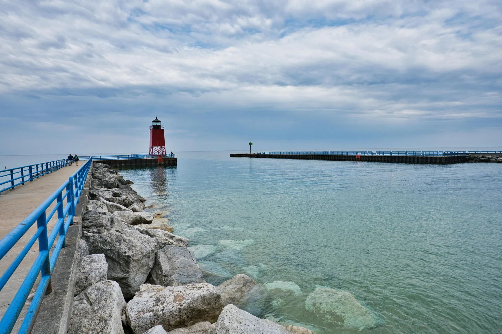 Beautiful view of Charlevoix South Pier Lighthouse with tranquil Lake Michigan waters. in Charlevoix Scavenger Hunt