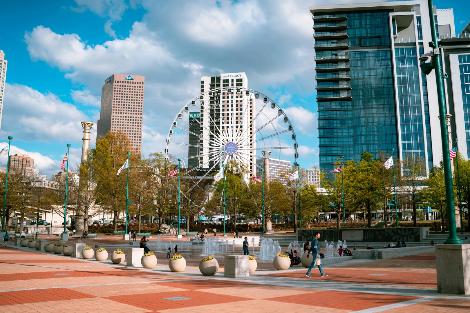 Day view of Centennial Olympic Park with skyscrapers and Ferris wheel in Atlanta, Georgia. in Atlanta Scavenger Hunt