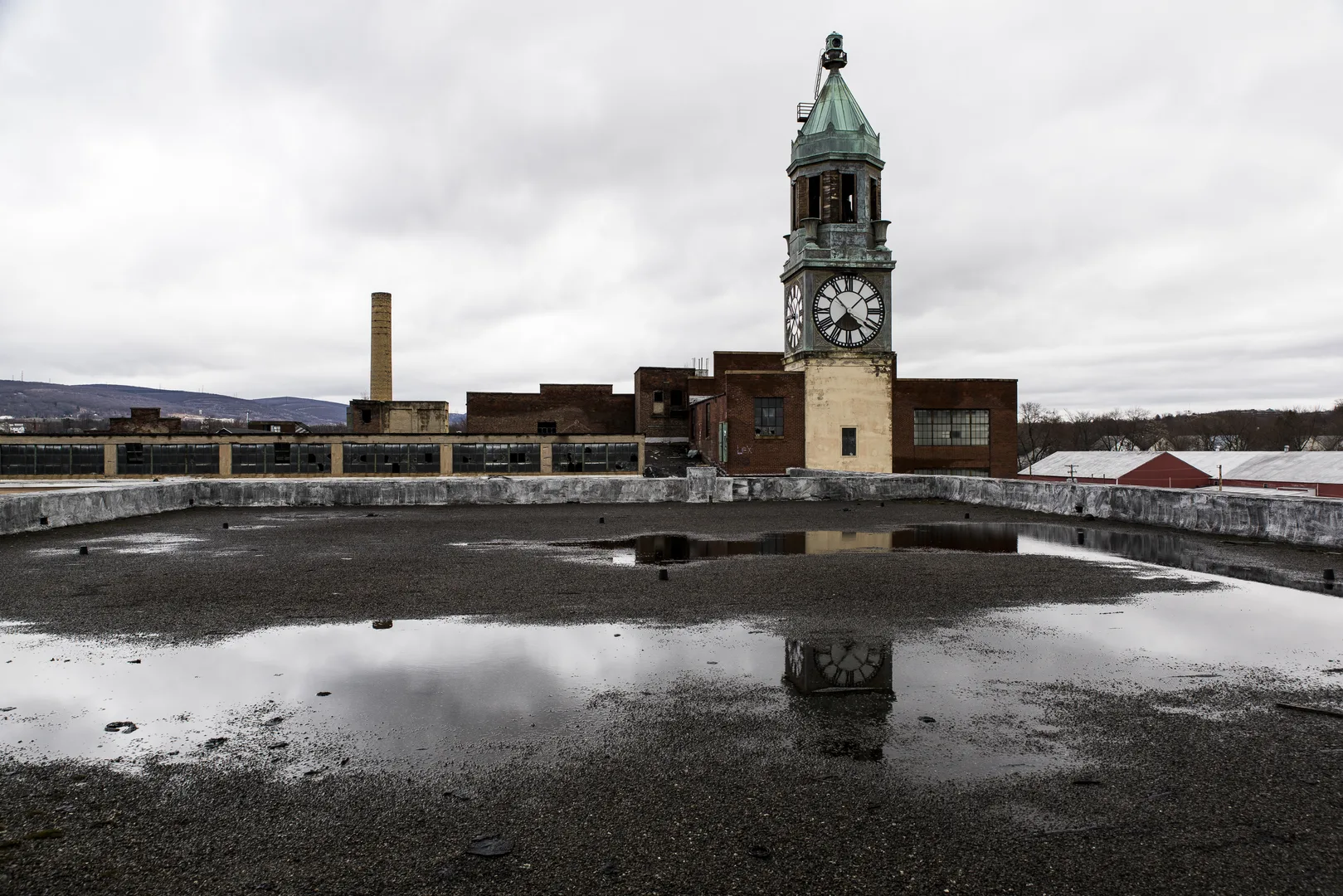An Exterior View With Reflection Of The Clock Tower And Factory Of The Abandoned Scranton Lace Factory In Scranton, Pennsylvania. in Scranton Scavenger Hunt