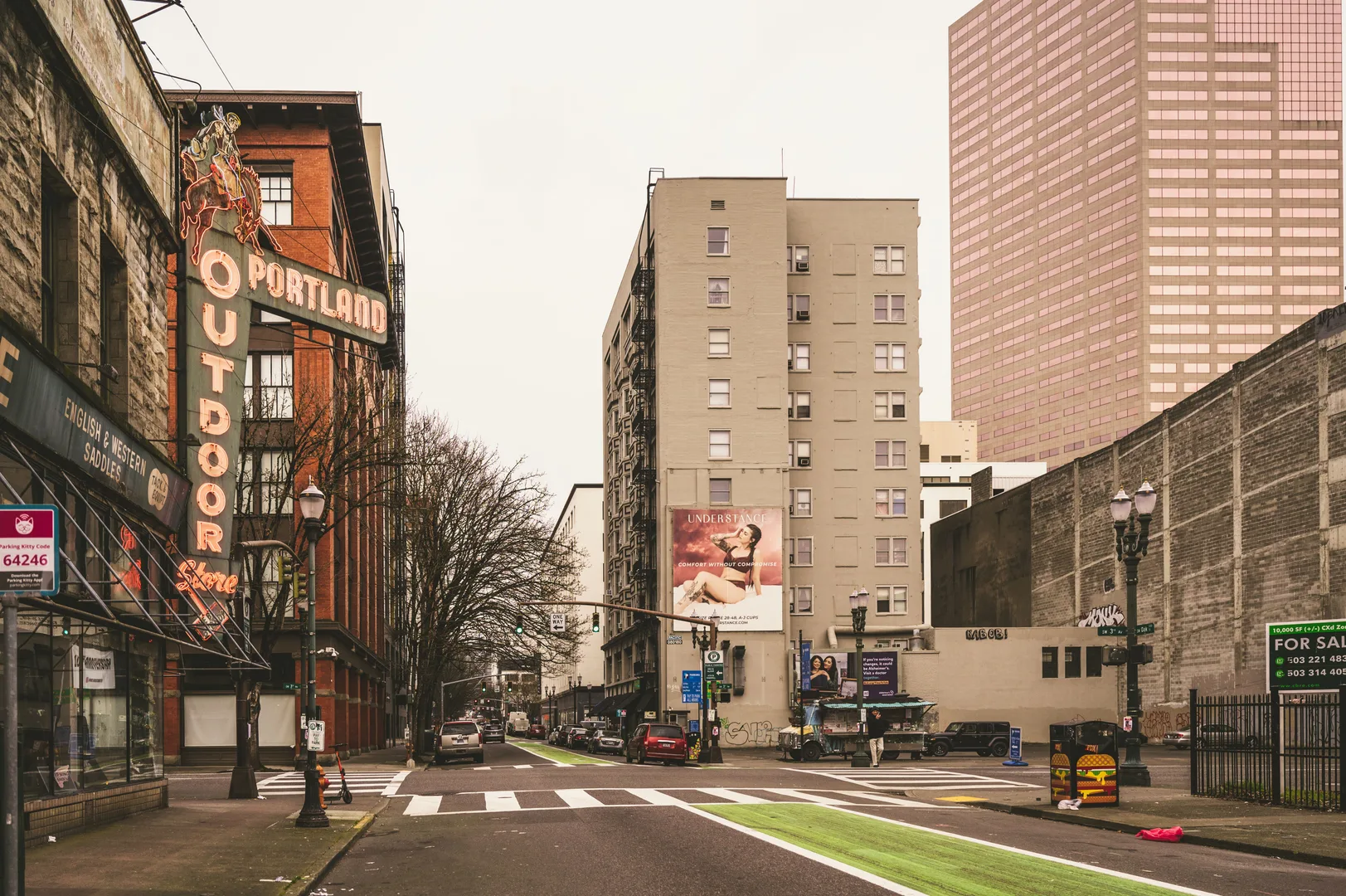 Urban street scene in downtown Portland featuring historic neon sign and modern architecture. in Portland Scavenger Hunt