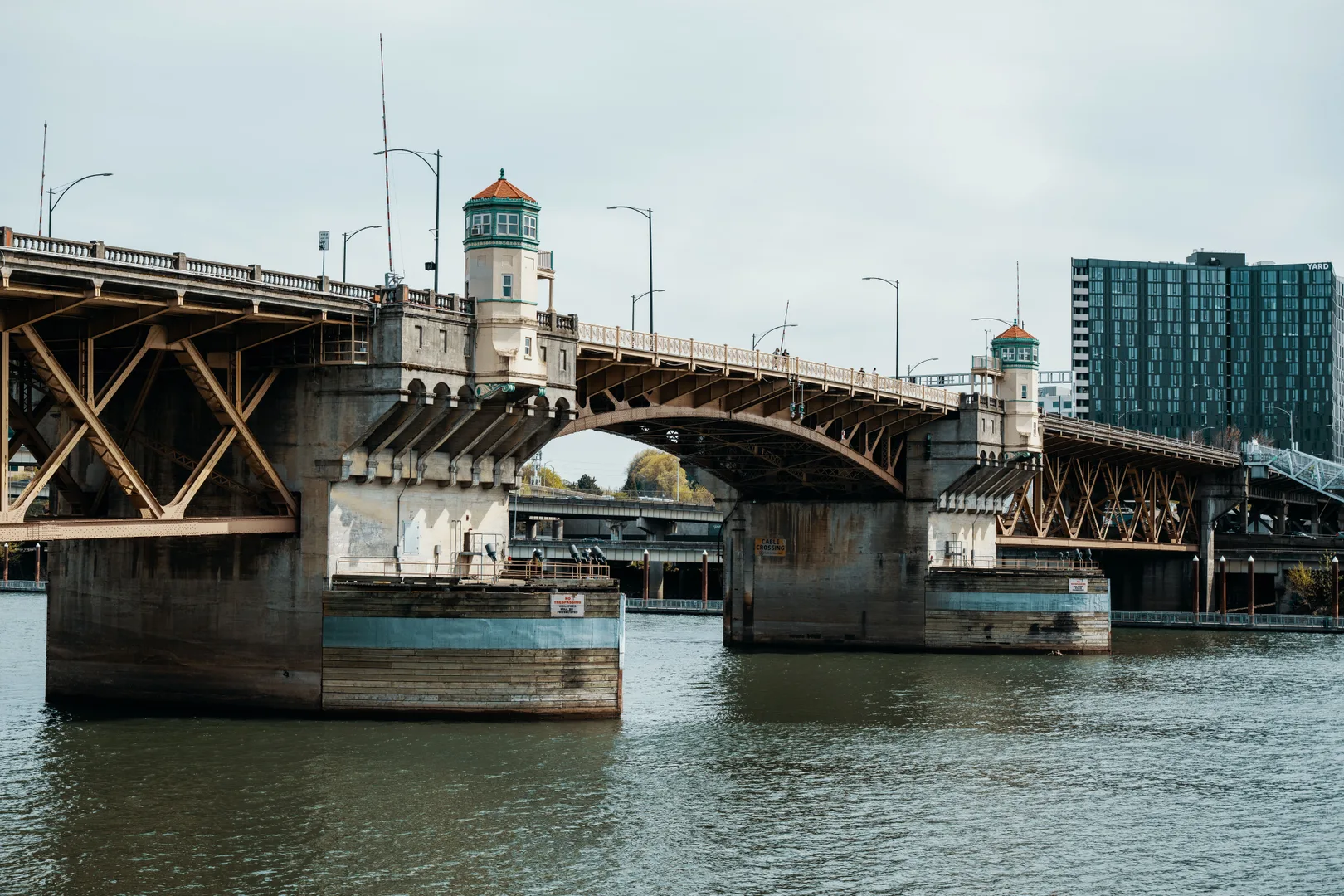 Daytime view of Burnside Bridge in Portland, Oregon, spanning the Willamette River. in Portland Scavenger Hunt