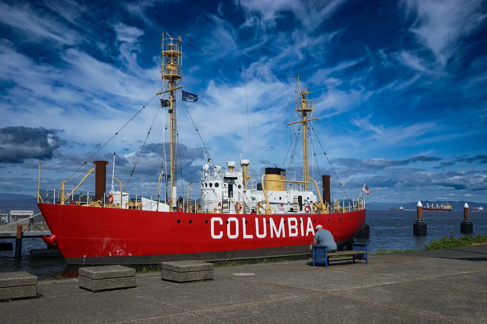A red lightship Columbia docked in Astoria, Oregon under a vibrant sky. in Astoria Scavenger Hunt