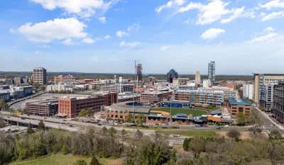 Aerial photo showing downtown Durham's vibrant skyline and cityscape on a sunny day. in Durham Scavenger Hunt, NC