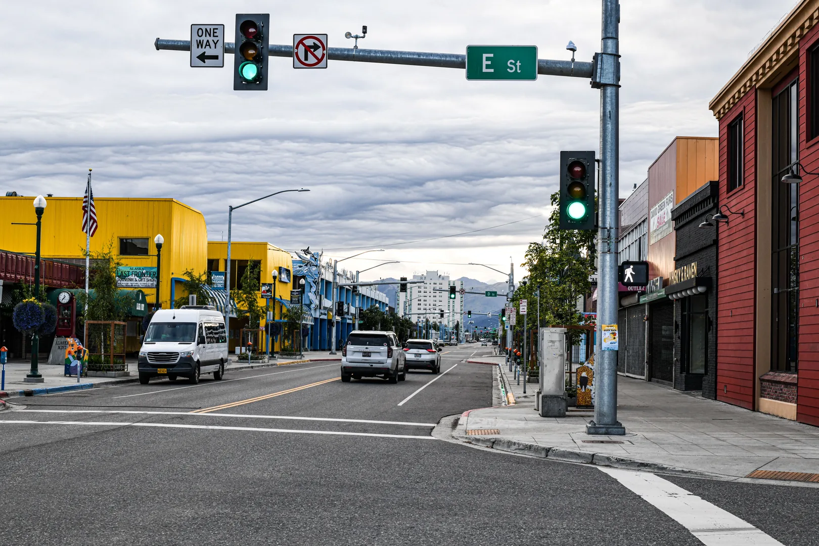 Vibrant morning on a bustling street in downtown Anchorage, Alaska, with colorful buildings and traffic. in Anchorage Scavenger Hunt, AK